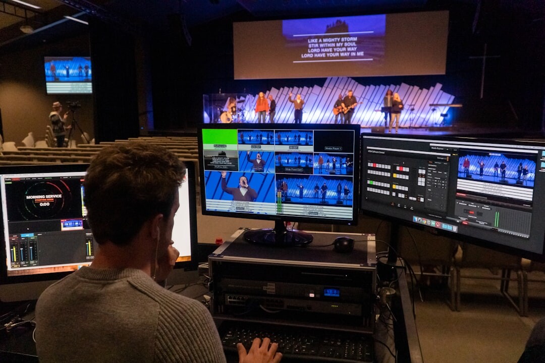 Digital newsroom with journalists and screens