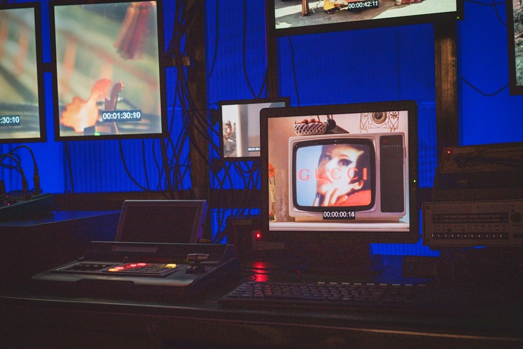 Multiple monitor screens showing live video broadcast